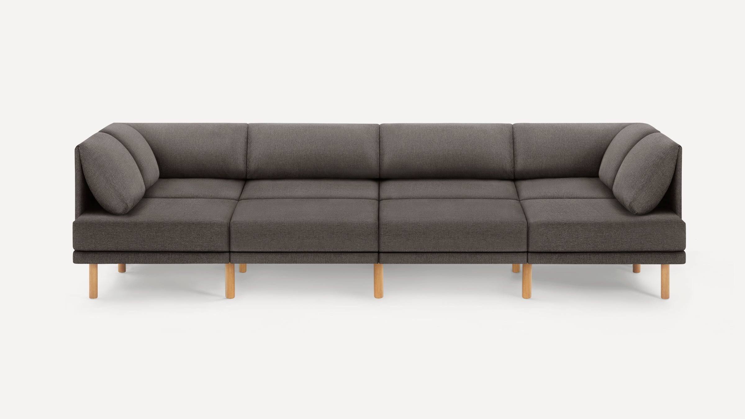 Modern dark gray sectional sofa with wooden legs, clean lines, and cushioned back and side supports, against a white background.