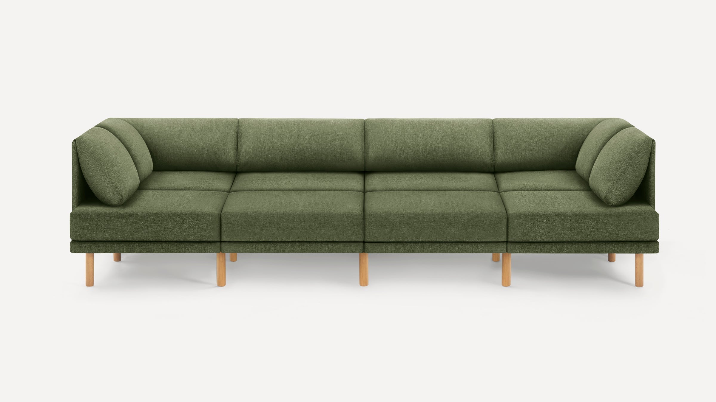 Long modern olive green fabric sectional sofa with wooden legs and cushioned backrest pillows on a white background.