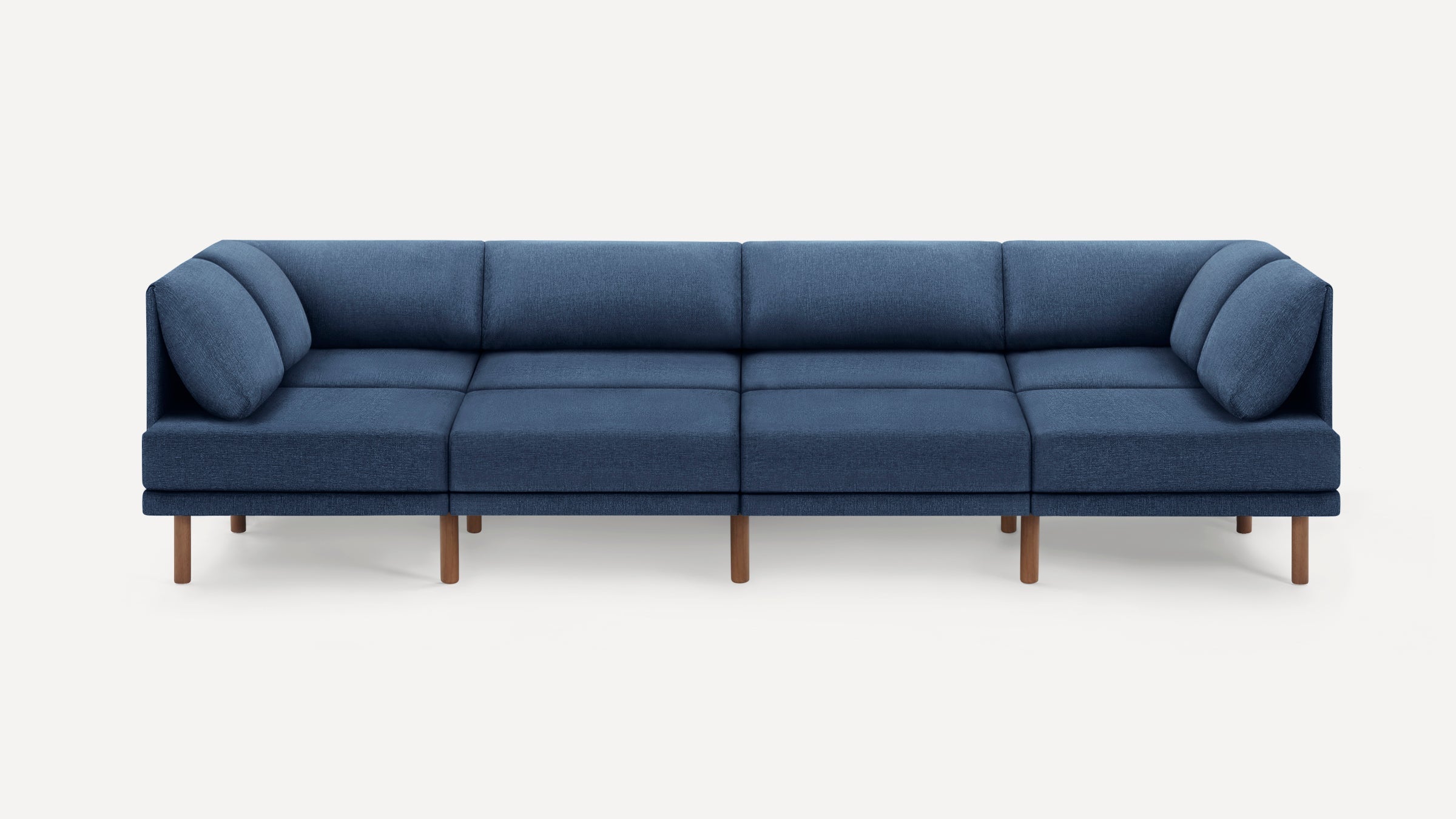 Modern navy blue sectional sofa with wooden legs, featuring clean lines and plush back cushions.