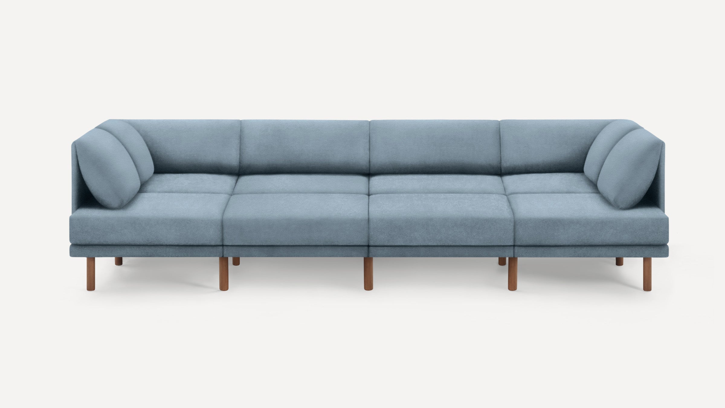 Modern light blue sectional sofa with wooden legs, featuring a clean, minimal design and two rounded armrest cushions on each end.