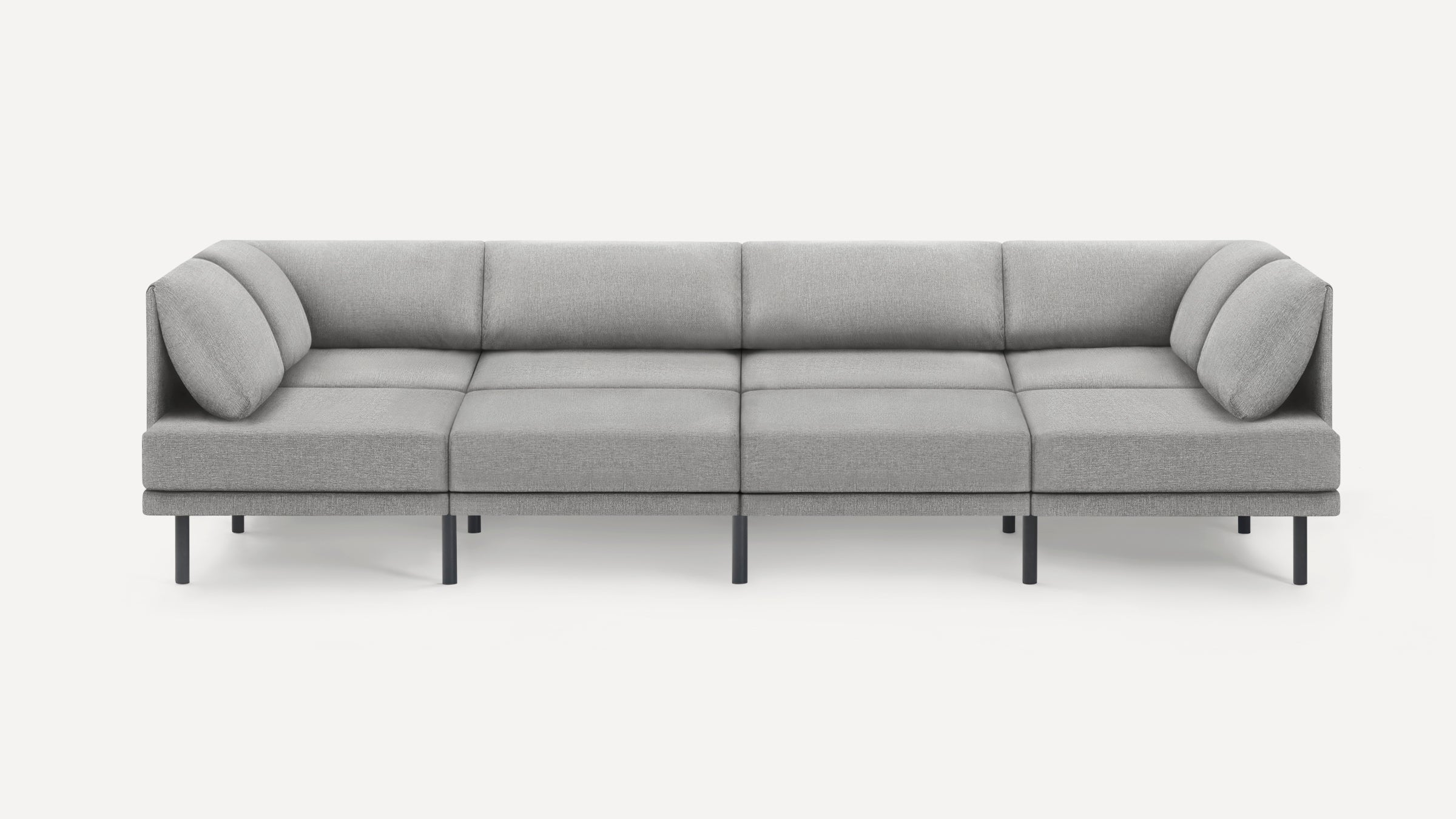 Modern minimalist light gray fabric sectional sofa with metal legs and plush cushions against a white background.
