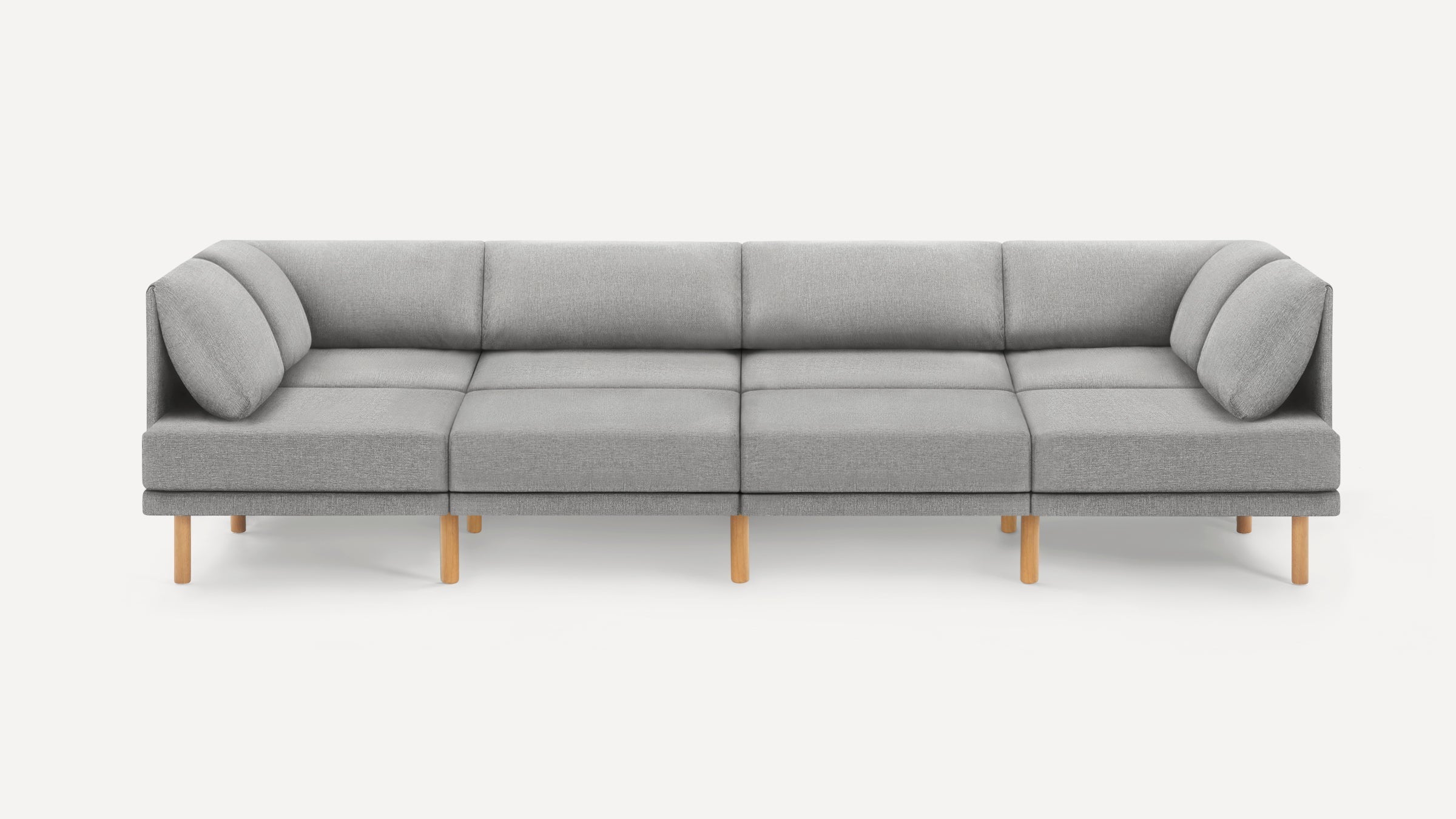 Modern modular grey fabric sofa with wooden legs, featuring clean lines and plush cushions for comfortable seating.
