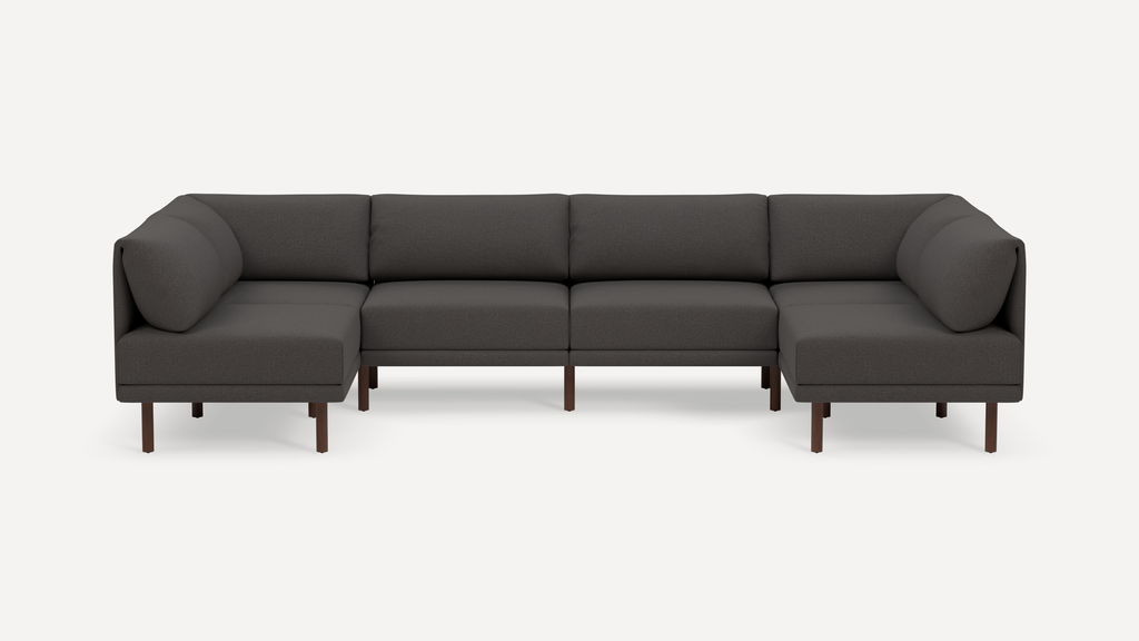Dark gray modern sectional sofa with clean lines, cushioned seats, and wooden legs against a white background.