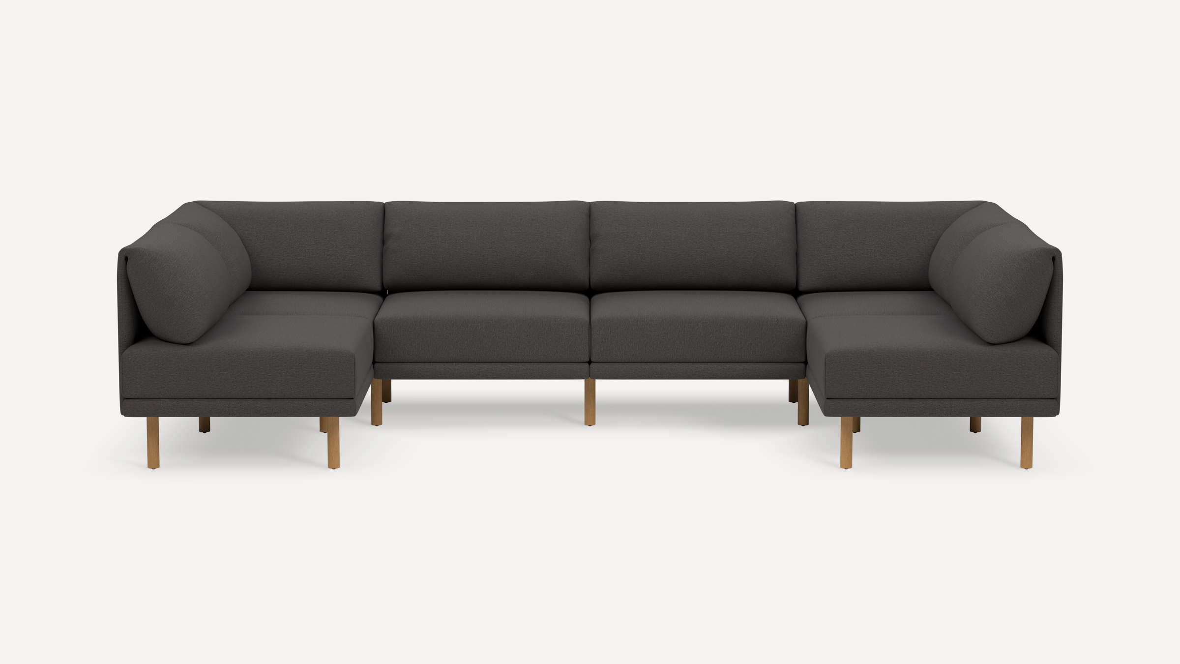 Dark gray sectional sofa with wooden legs, modern design, and cushioned back and seat for comfortable seating.