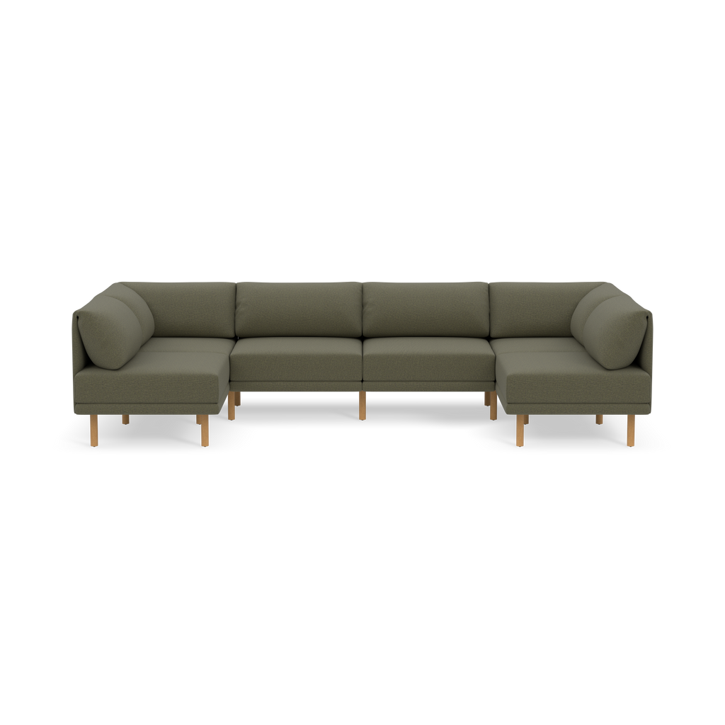 Modern Moss green L-shaped sofa with wooden legs, cushioned seats and backrests, designed for spacious seating and comfort.
