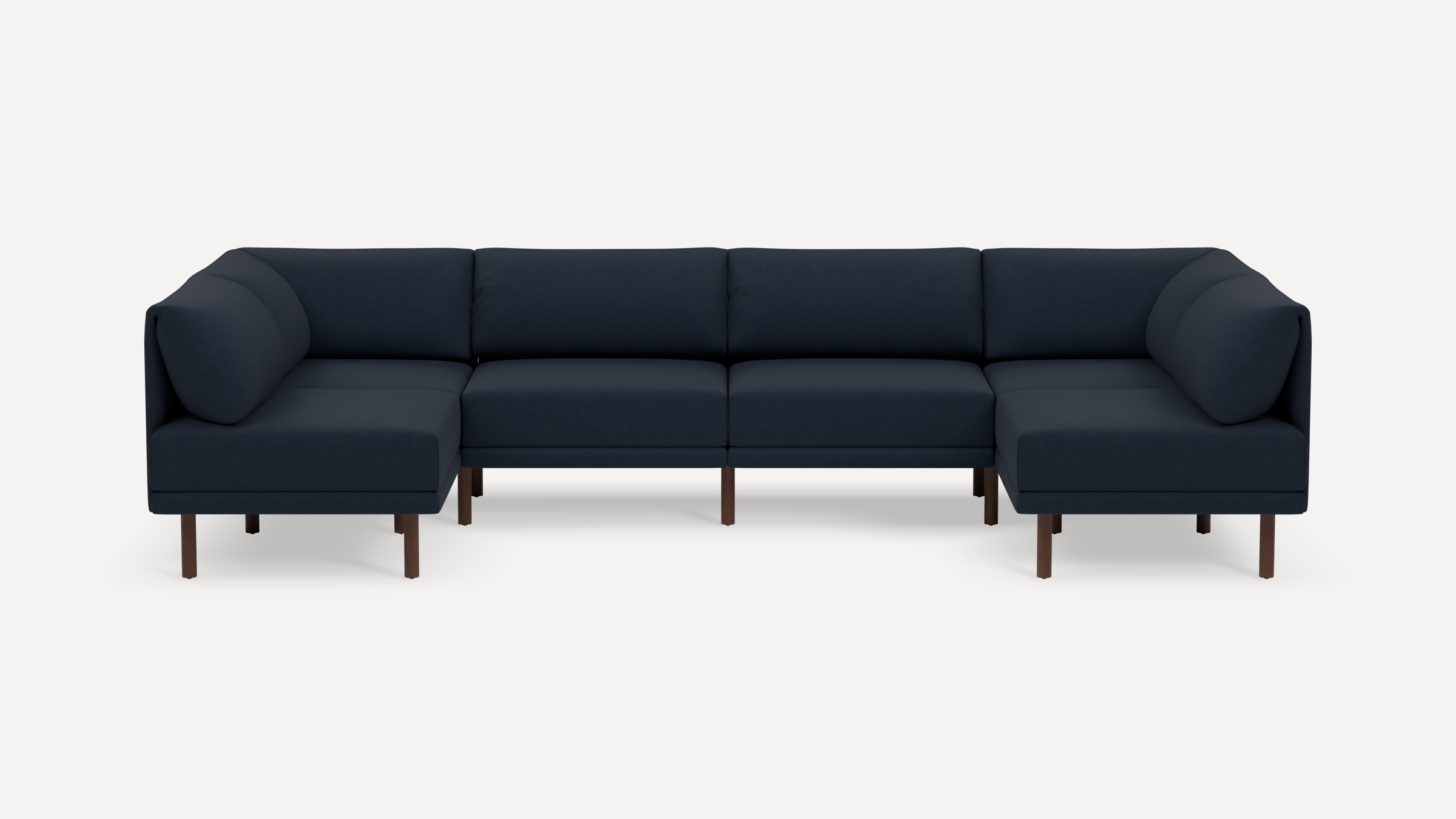 Modern navy blue sectional sofa with clean lines, plush cushions, and wooden legs, designed for spacious seating in a minimalist style.