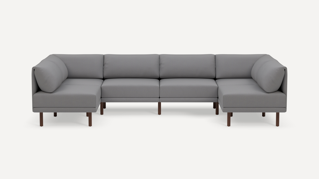 Modern gray fabric modular sectional sofa with clean lines and wooden legs on white background.
