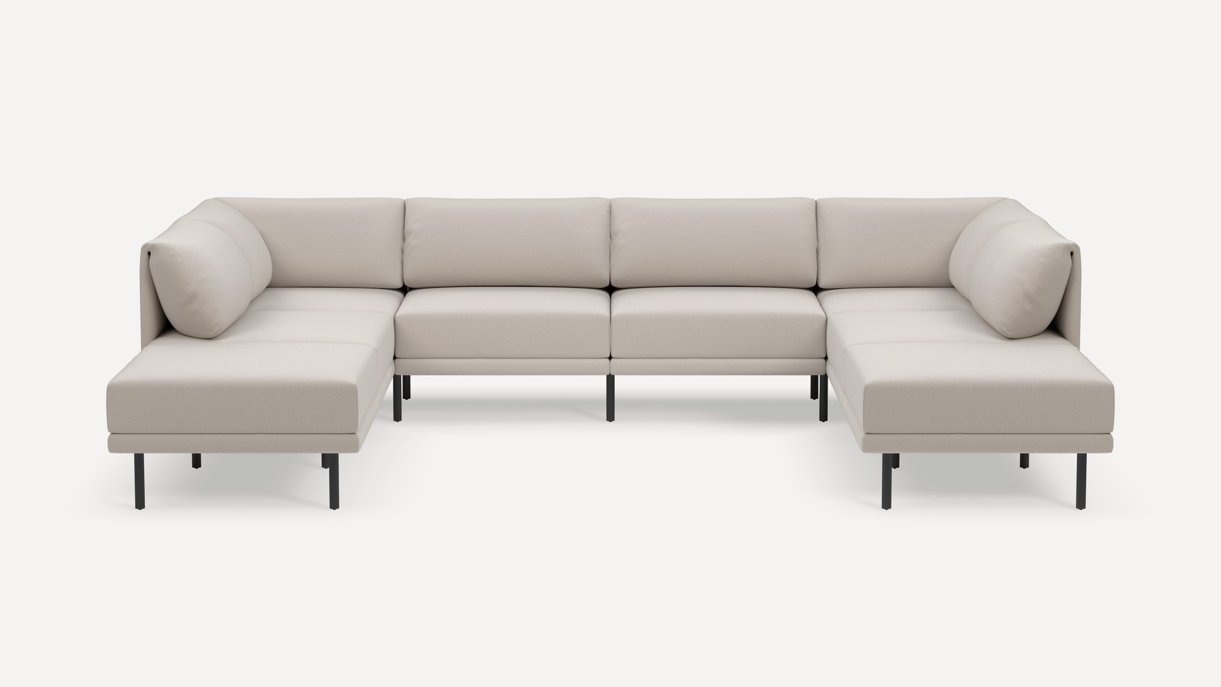 Modern U-shaped sectional sofa with light beige upholstery, cushioned seats, backrests, and slim black metal legs, set against a white background.