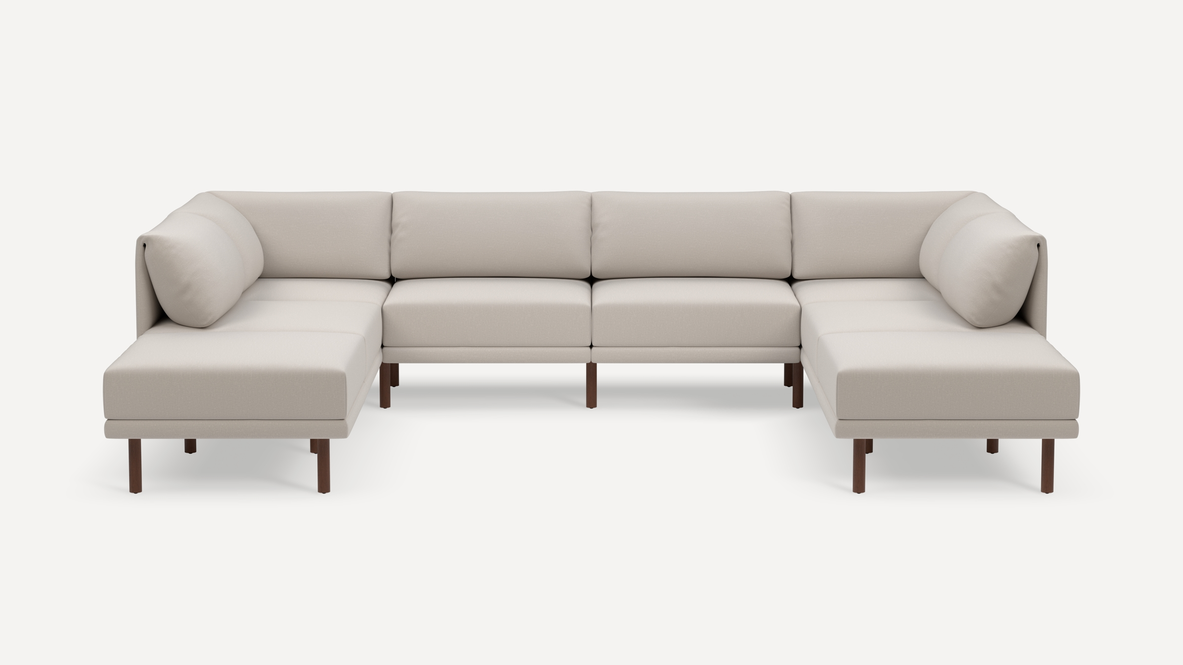Modern U-shaped sectional sofa with light beige fabric upholstery, cushioned backrests, arms, and wooden legs, designed for spacious seating.