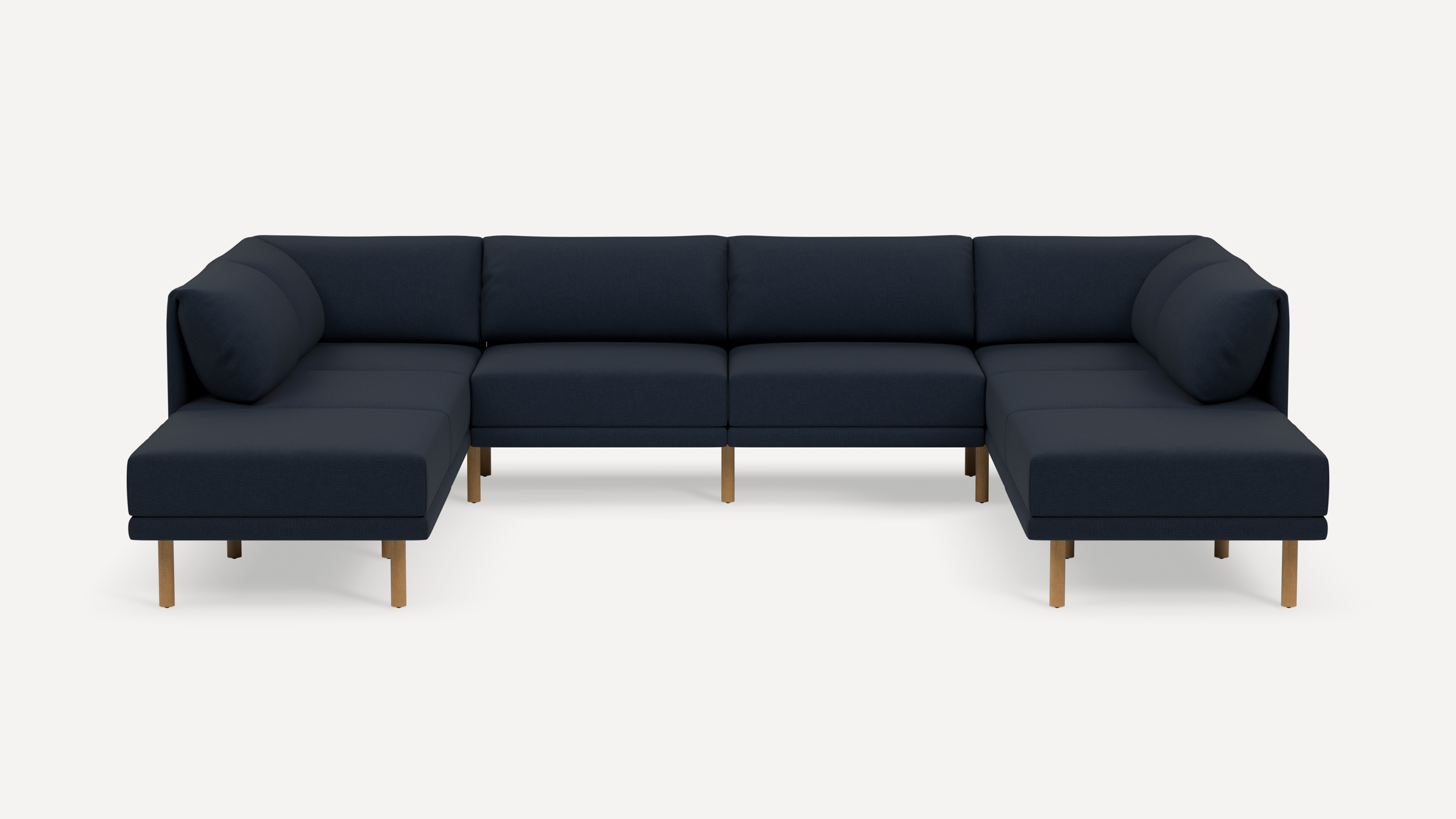 Large modern navy blue U-shaped sectional sofa with wooden legs and cushioned backrests, displayed on a plain white background.