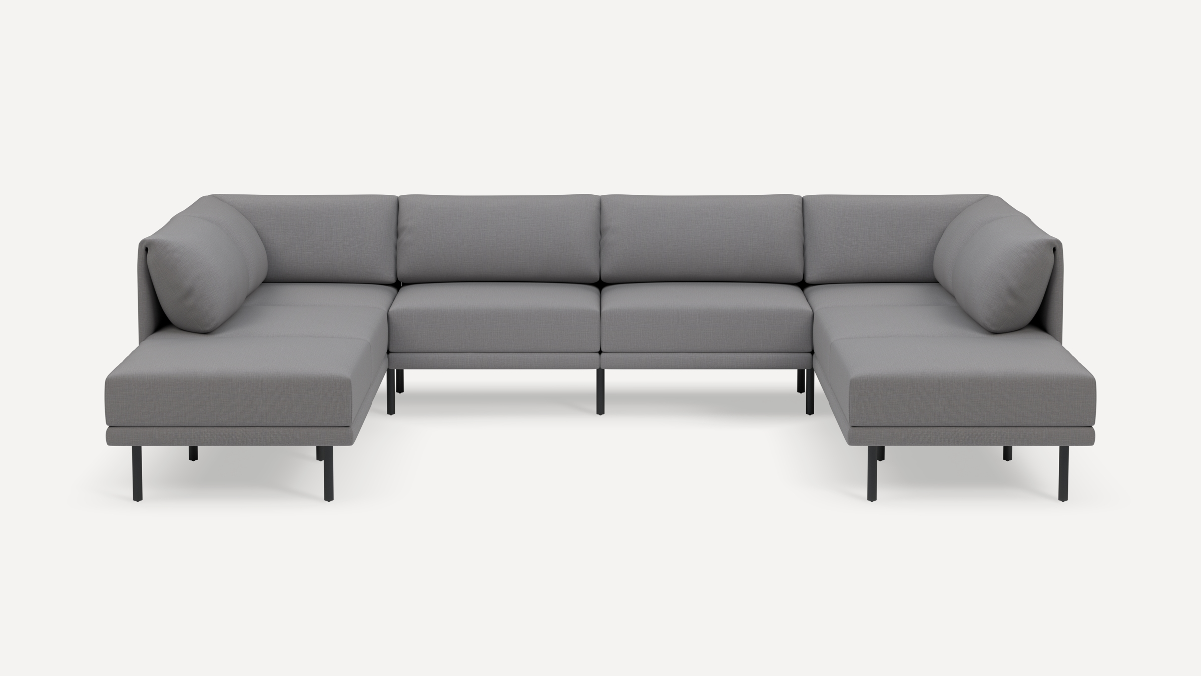 Modern gray fabric U-shaped sectional sofa with low back cushions and slim black metal legs on a white background.