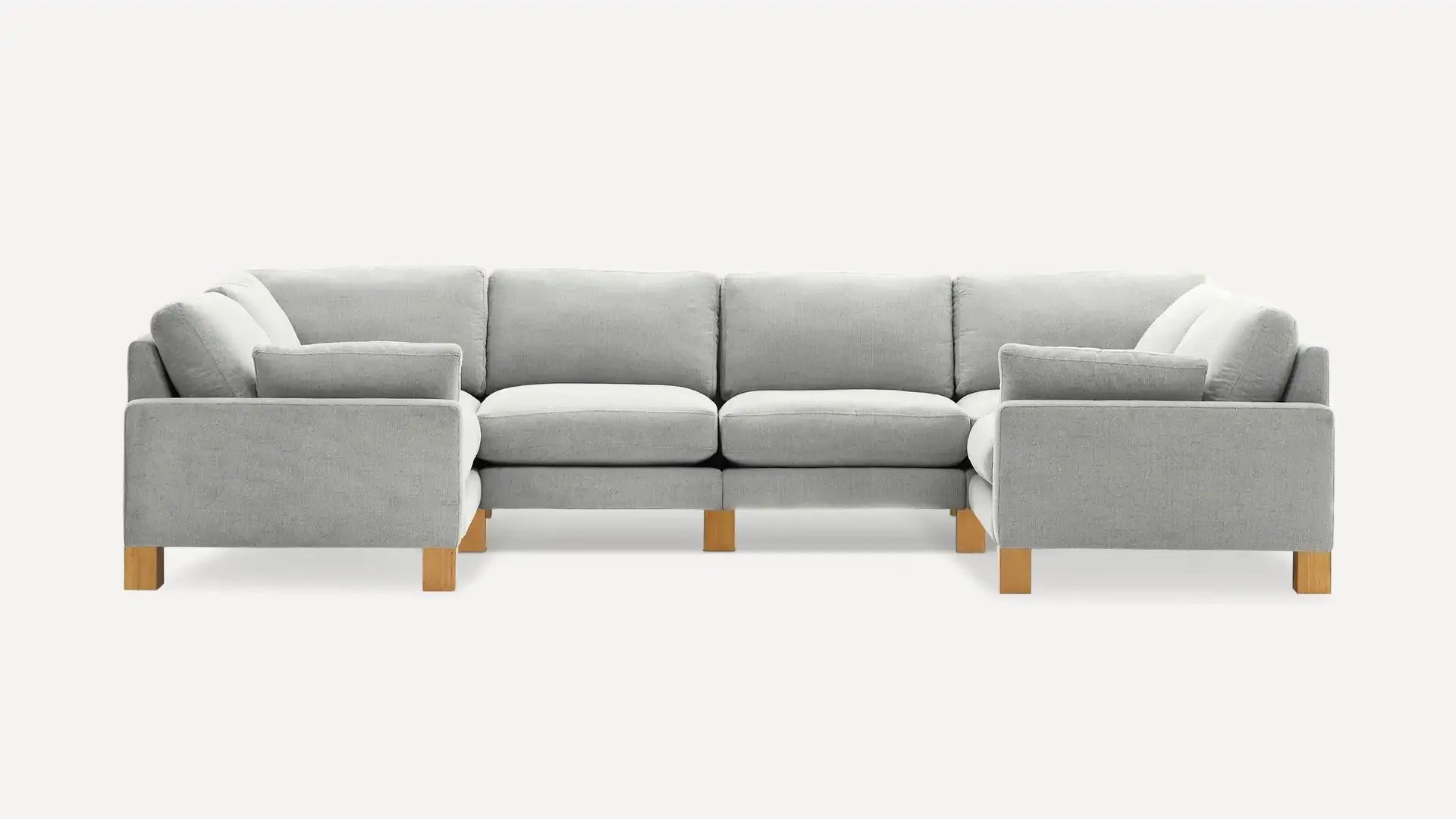 modern l - shaped sectional sofa with light gray fabric upholstery, light wood legs, and clean lines on a white background