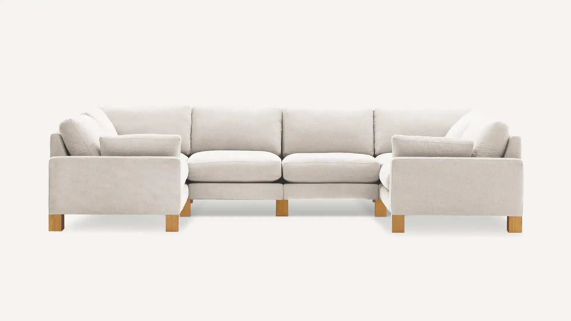 modern l - shaped sectional sofa with light beige upholstery and light wood legs, featuring a clean, minimalist design