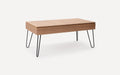 Rectangular wooden coffee table with two-segment top and black metal hairpin legs on a white background.