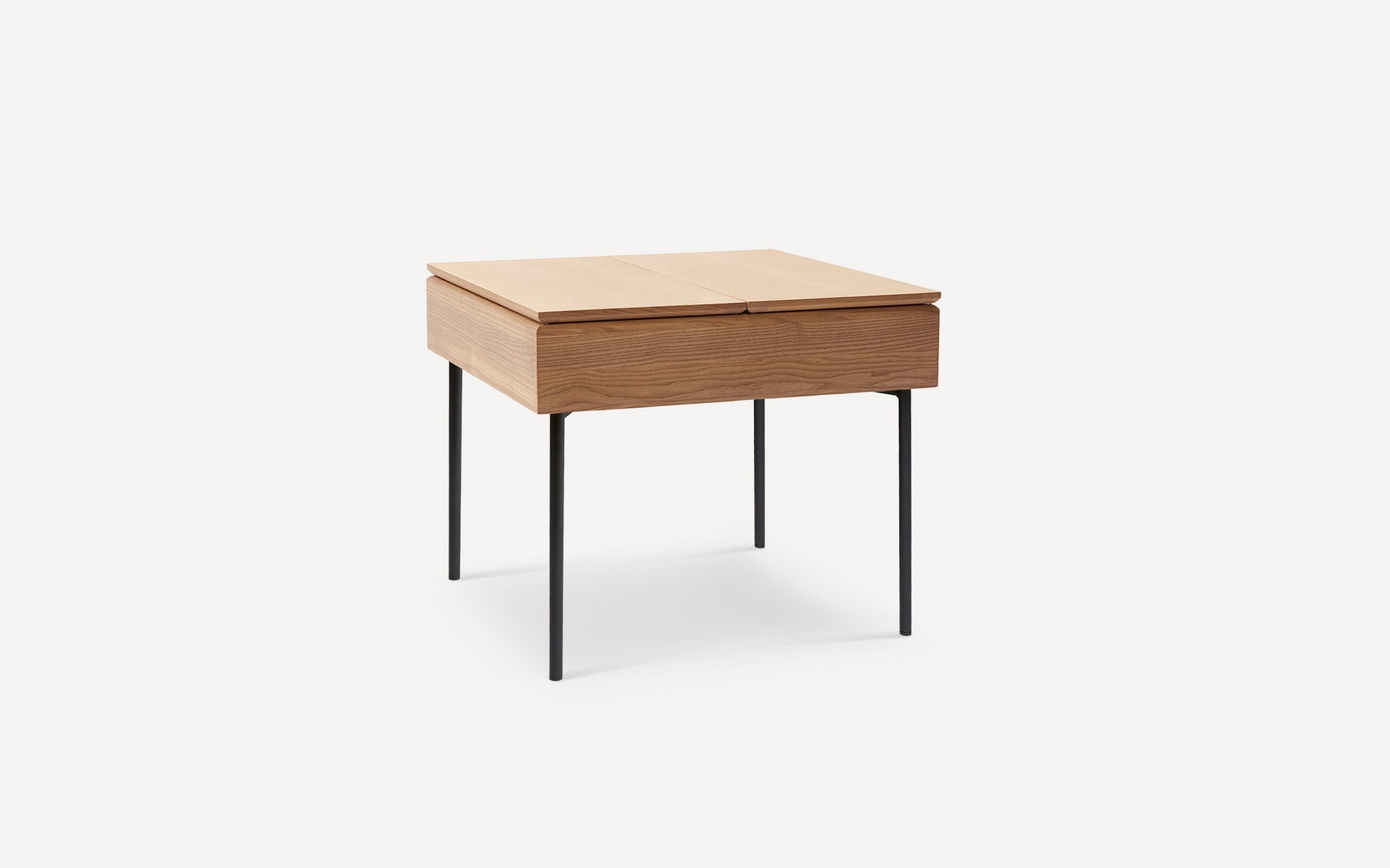 Modern square wooden side table with black metal legs and a smooth, flat top, minimalist design.