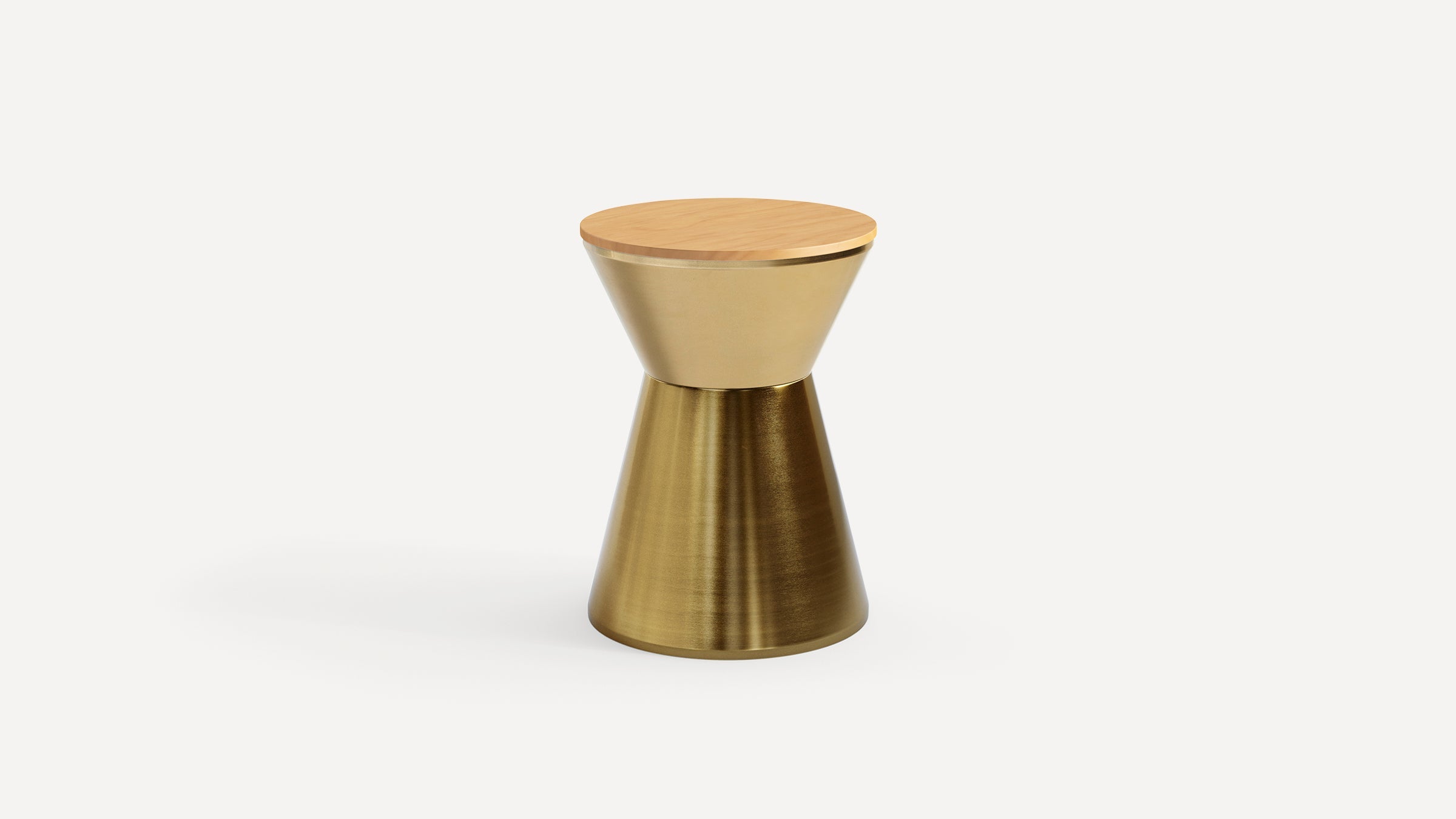Modern hourglass-shaped side table with a brushed gold metal base and a smooth light wood top, isolated on white.