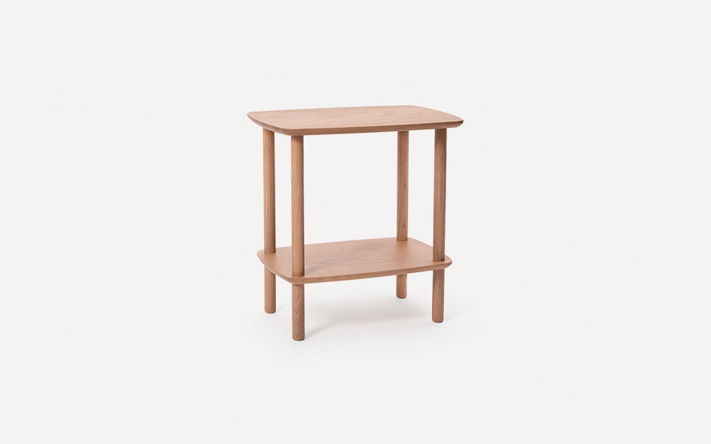 Light wooden two-tier side table with rounded rectangular surfaces and four sturdy cylindrical legs.