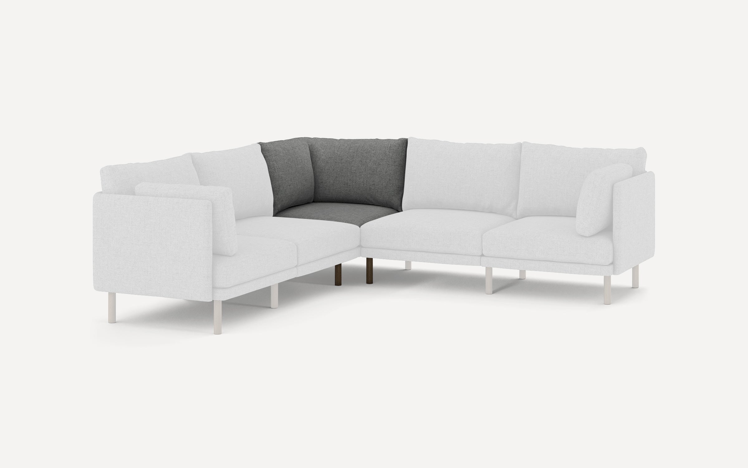 L-shaped sectional sofa with light grey fabric and contrasting dark grey cushions in the corner, supported by slim white legs.