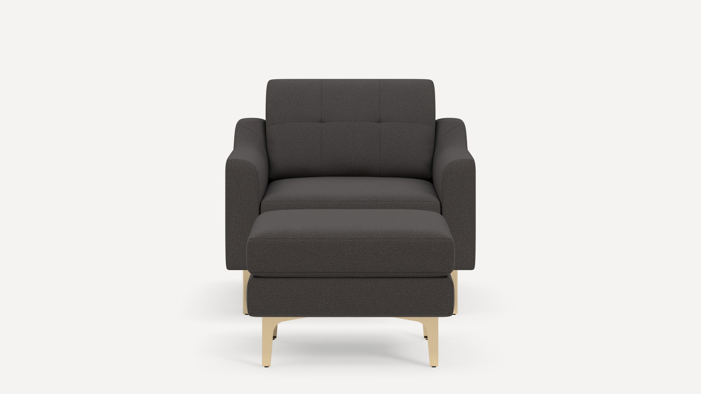Front view of a dark gray modern armchair with a matching ottoman and light wooden legs on a plain white background.