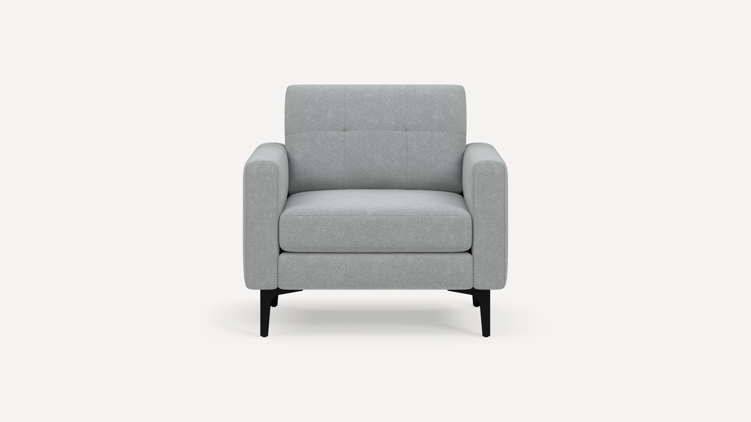 Modern light gray upholstered armchair with wide arms, tufted backrest, and black metal legs, shown against a white background.