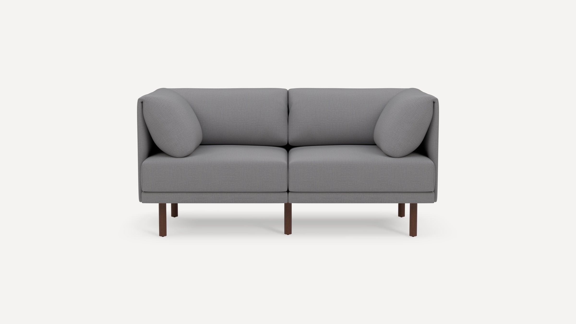 Modern gray two-seater sofa with clean lines, square cushions, and dark wooden legs, set against a white background.
