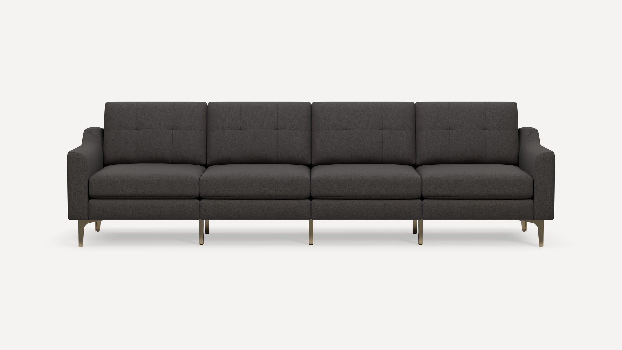 Contemporary four-seat dark gray fabric sofa with tufted cushions, curved armrests, and slim metallic legs.