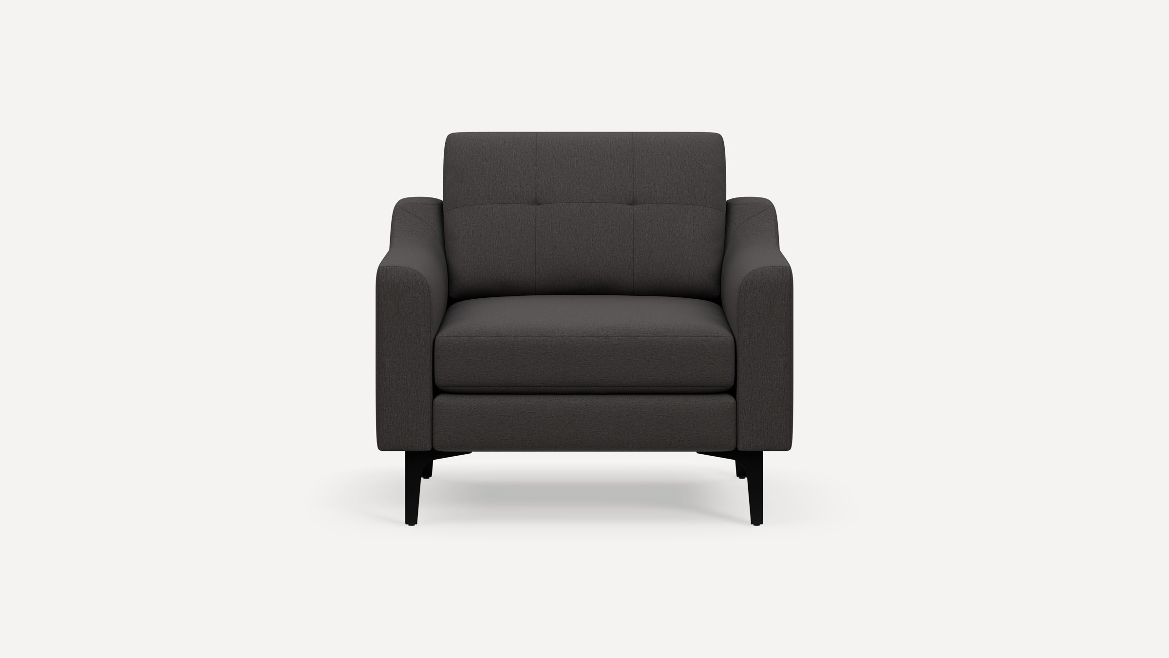 Front view of a modern, dark gray fabric armchair with black tapered legs and cushioned seat and backrest.