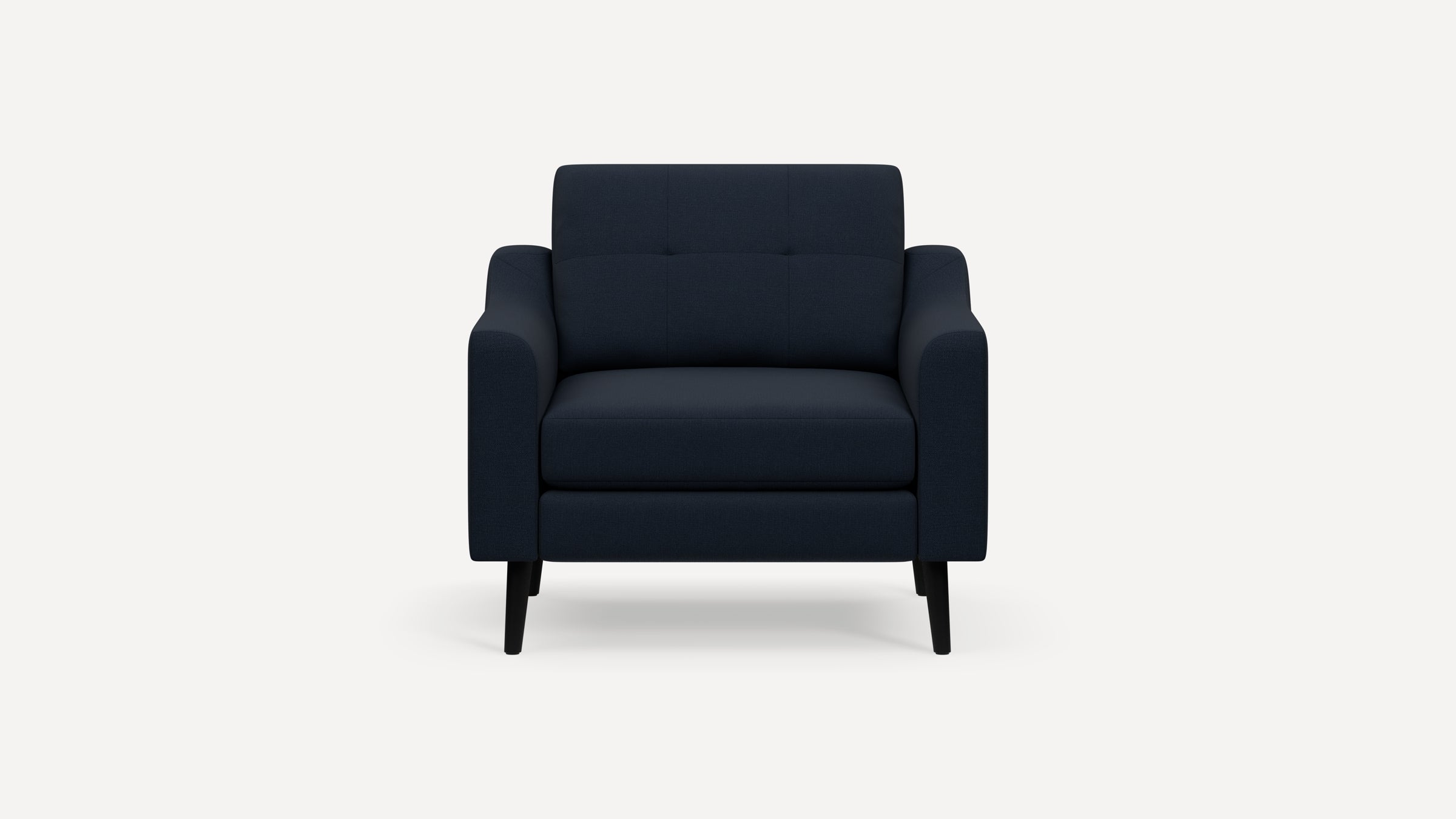 Front-facing navy blue upholstered armchair with tufted backrest, straight armrests, and black wooden legs on white background.