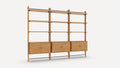 Modern wooden shelving unit with three sections, each featuring two open shelves above and a closed cabinet below.