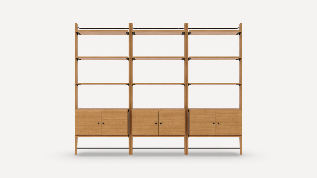 Three-section wooden shelving unit with three shelves and a two-door cabinet at the bottom in each section, featuring black metal accents.