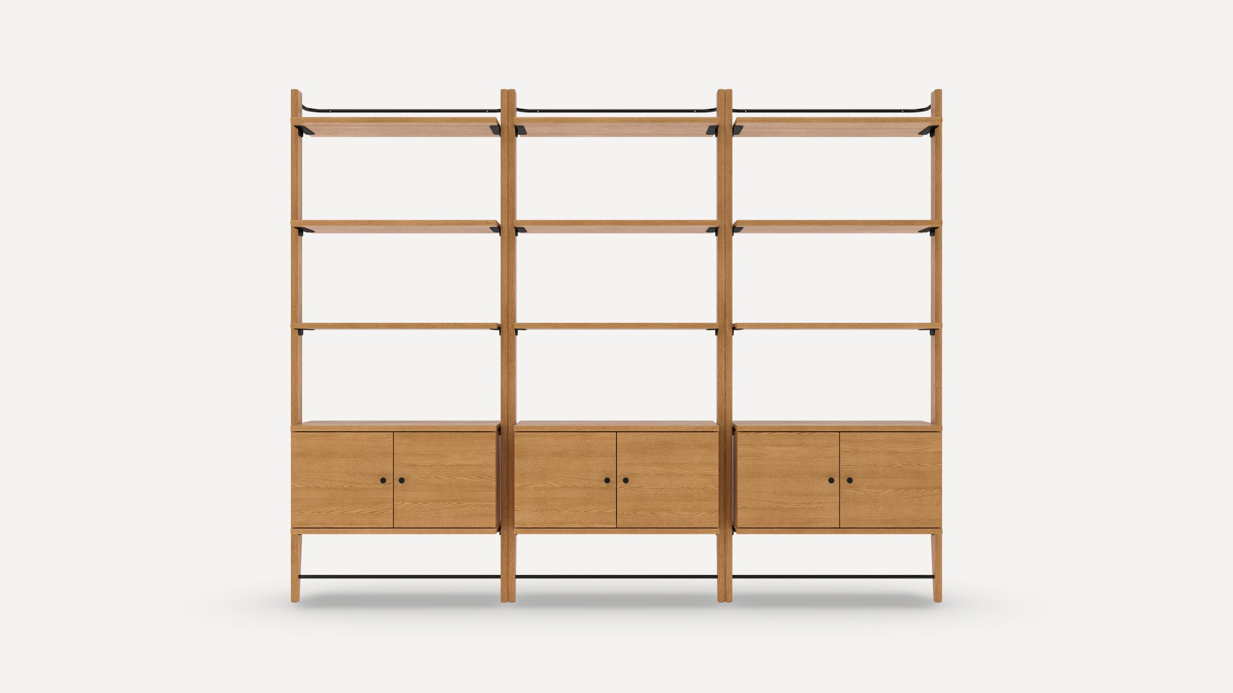 Three-section wooden shelving unit with three shelves and a two-door cabinet at the bottom in each section, featuring black metal accents.