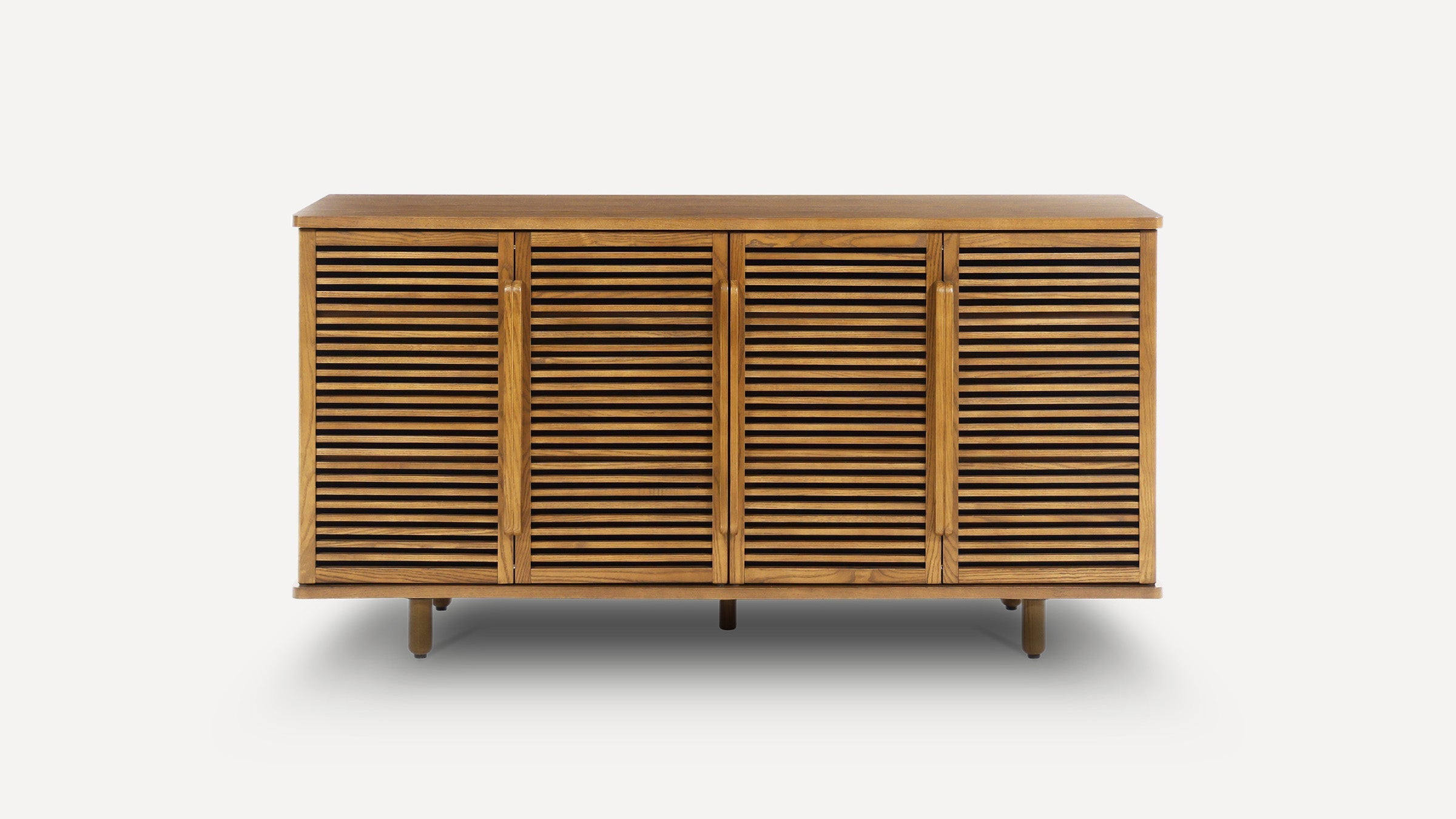 Mid-century modern wooden sideboard with four louvered doors, vertical handles, and round legs, finished in warm brown.
