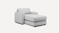 Light gray upholstered chaise lounge with cushioned backrest and armrest, supported by short wooden legs.