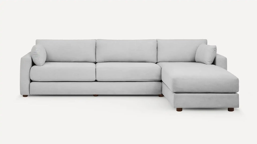 modern light gray sectional sofa with chaise lounge and wooden legs, featuring a clean, minimalist design
