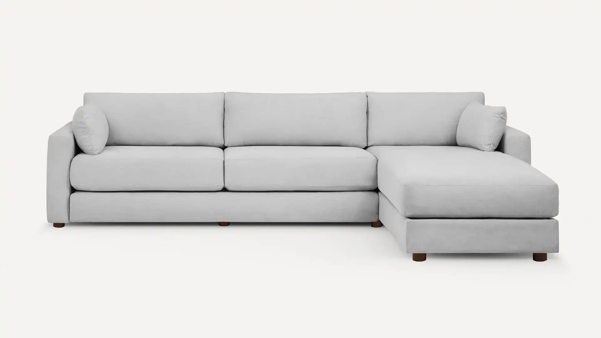 modern light gray sectional sofa with chaise lounge and wooden legs, featuring a clean, minimalist design