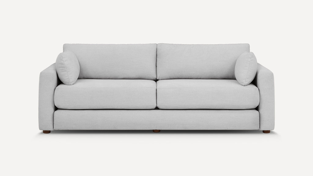 Modern light gray fabric sofa with two large seat cushions, back cushions, and rounded armrests, shown against a plain white background.