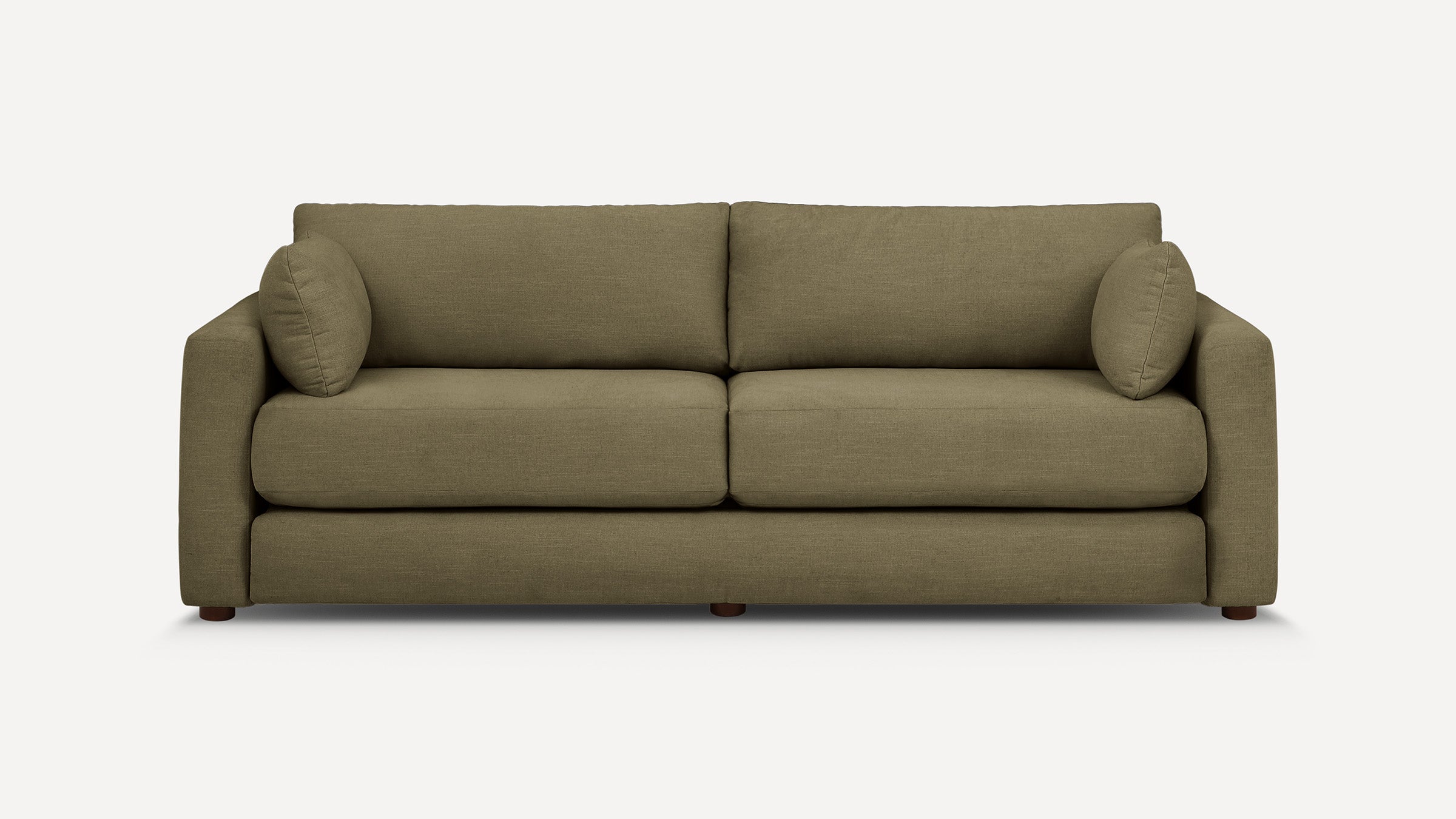 Two-seat olive green fabric sofa with rounded armrests, plush cushions, and two cylindrical side pillows on a white background.