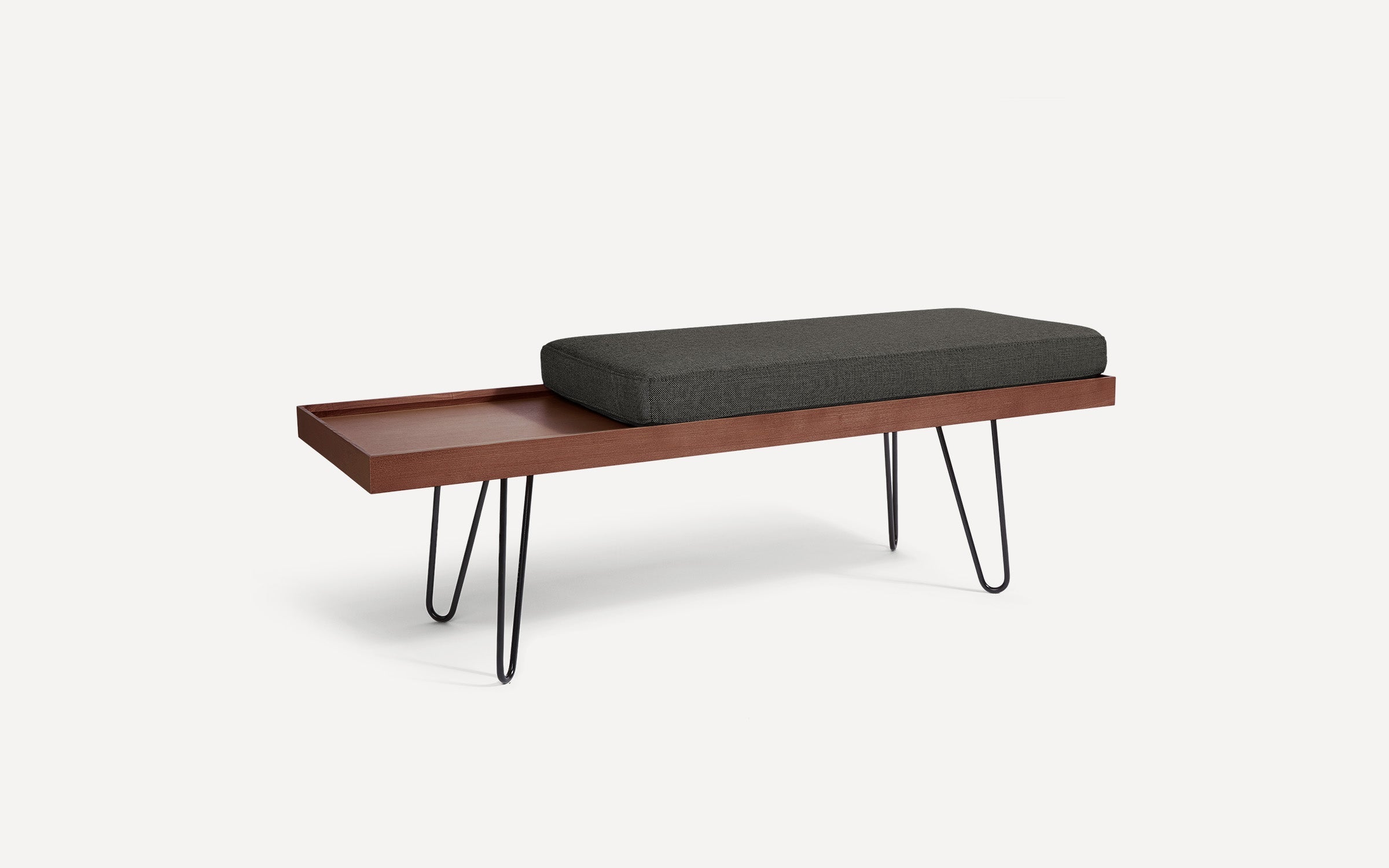 modern wooden bench with black cushion and hairpinned legs on white background