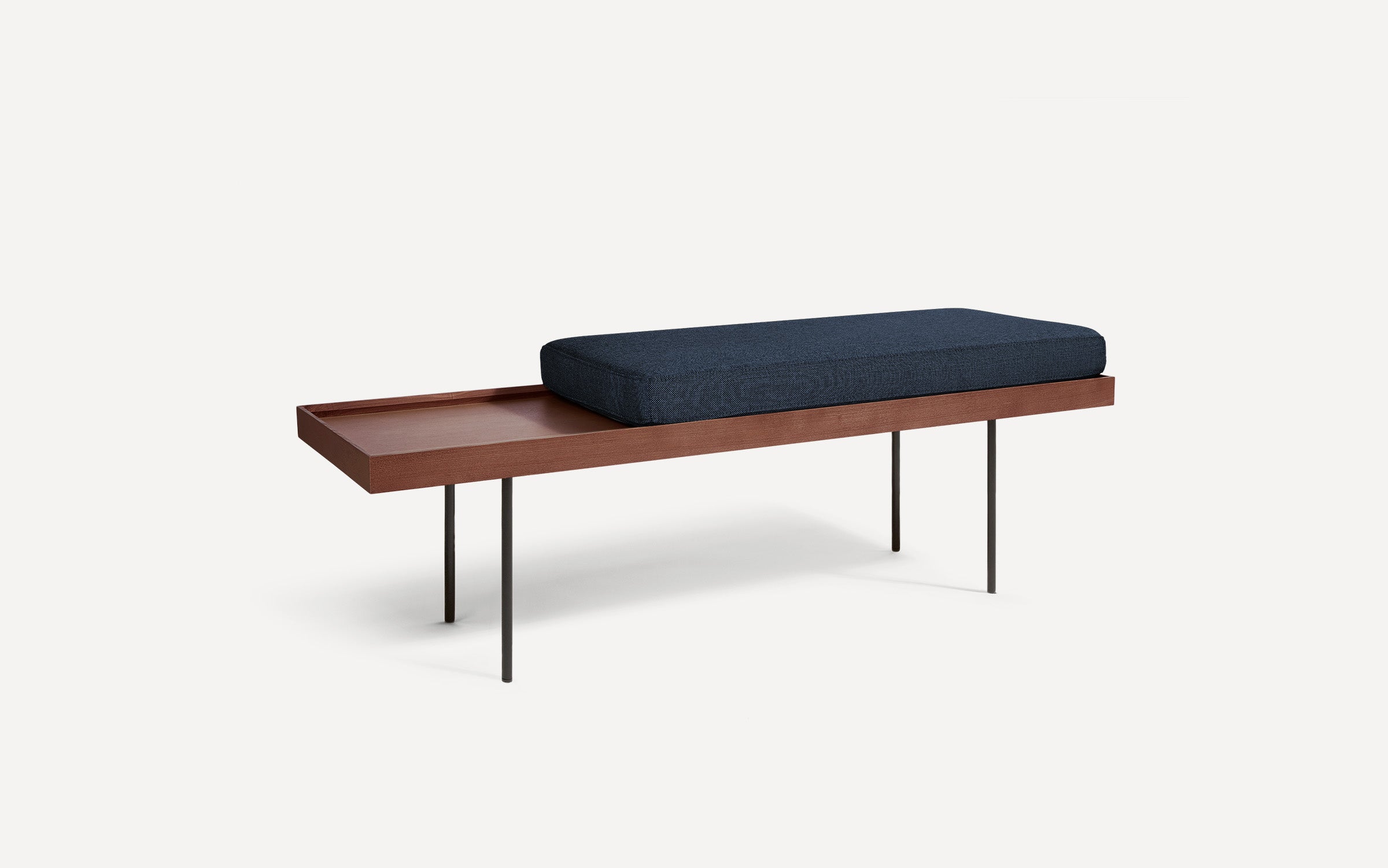 modern wooden bench with blue cushion and black metal legs on white background