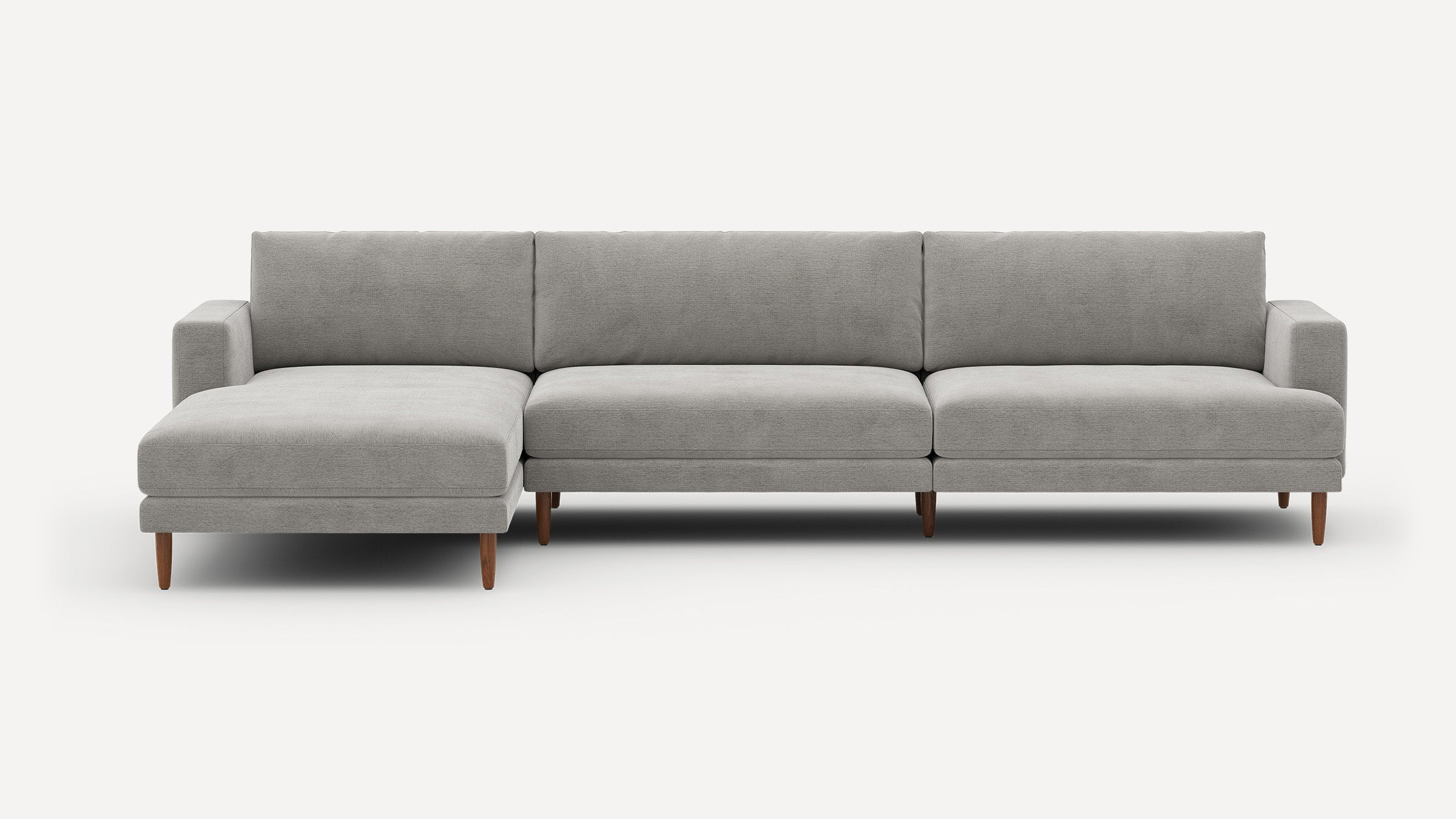 Modern light gray sectional sofa with left chaise, wooden tapered legs, and clean, minimalist design on white background.