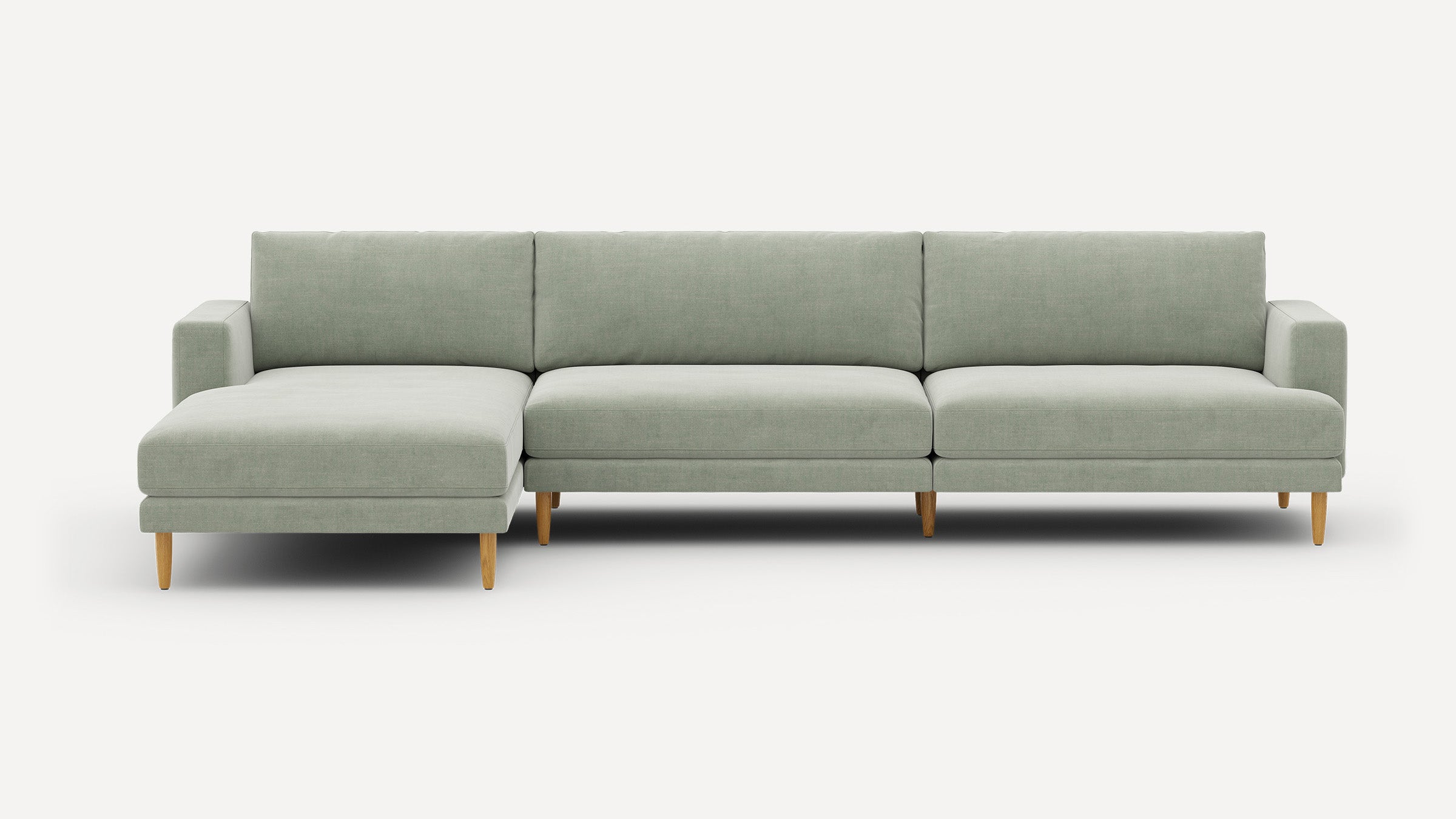 Modern light gray sectional sofa with left chaise, straight arms, wooden tapered legs, and cushioned back and seat.