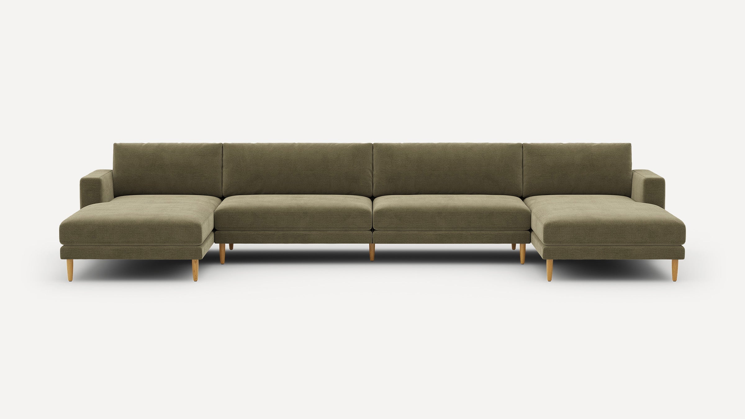 Large olive green sectional sofa with wooden tapered legs, featuring two chaise lounges and a modern minimalist design.