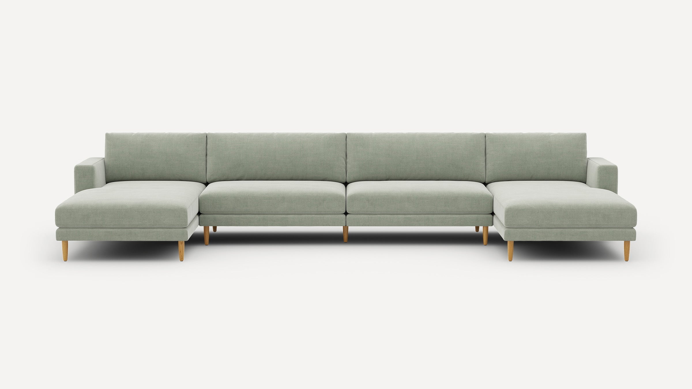 Modern light gray sectional sofa with wooden legs, featuring two chaise lounges on each end and clean, minimalist design.