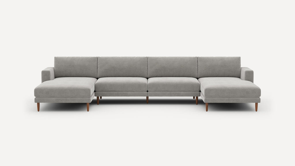 Modern gray sectional sofa with two chaise lounges, wooden legs, and clean, minimalist design.