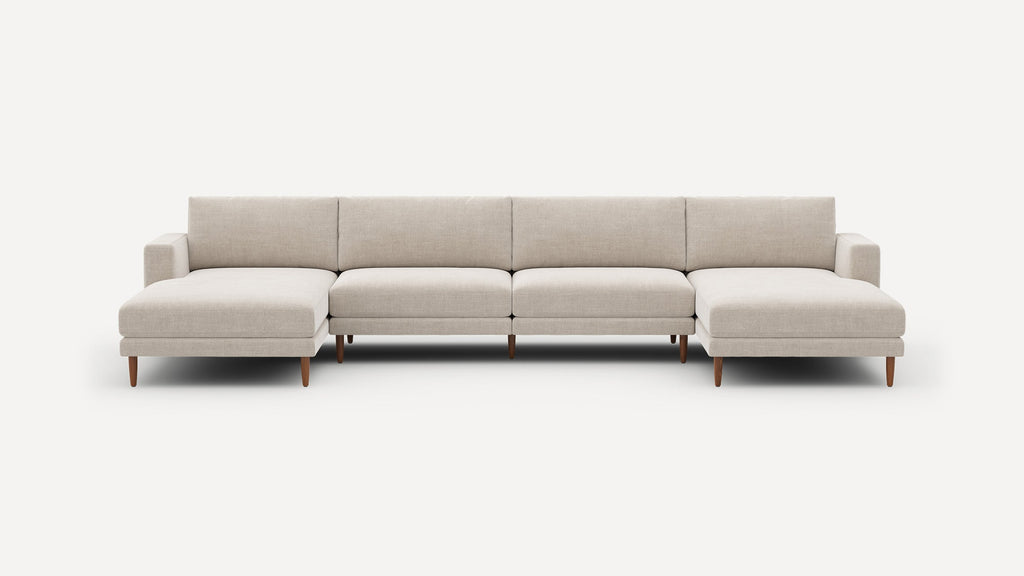Modern beige fabric sectional sofa with clean lines, wooden legs, and two chaise ends against a white background.
