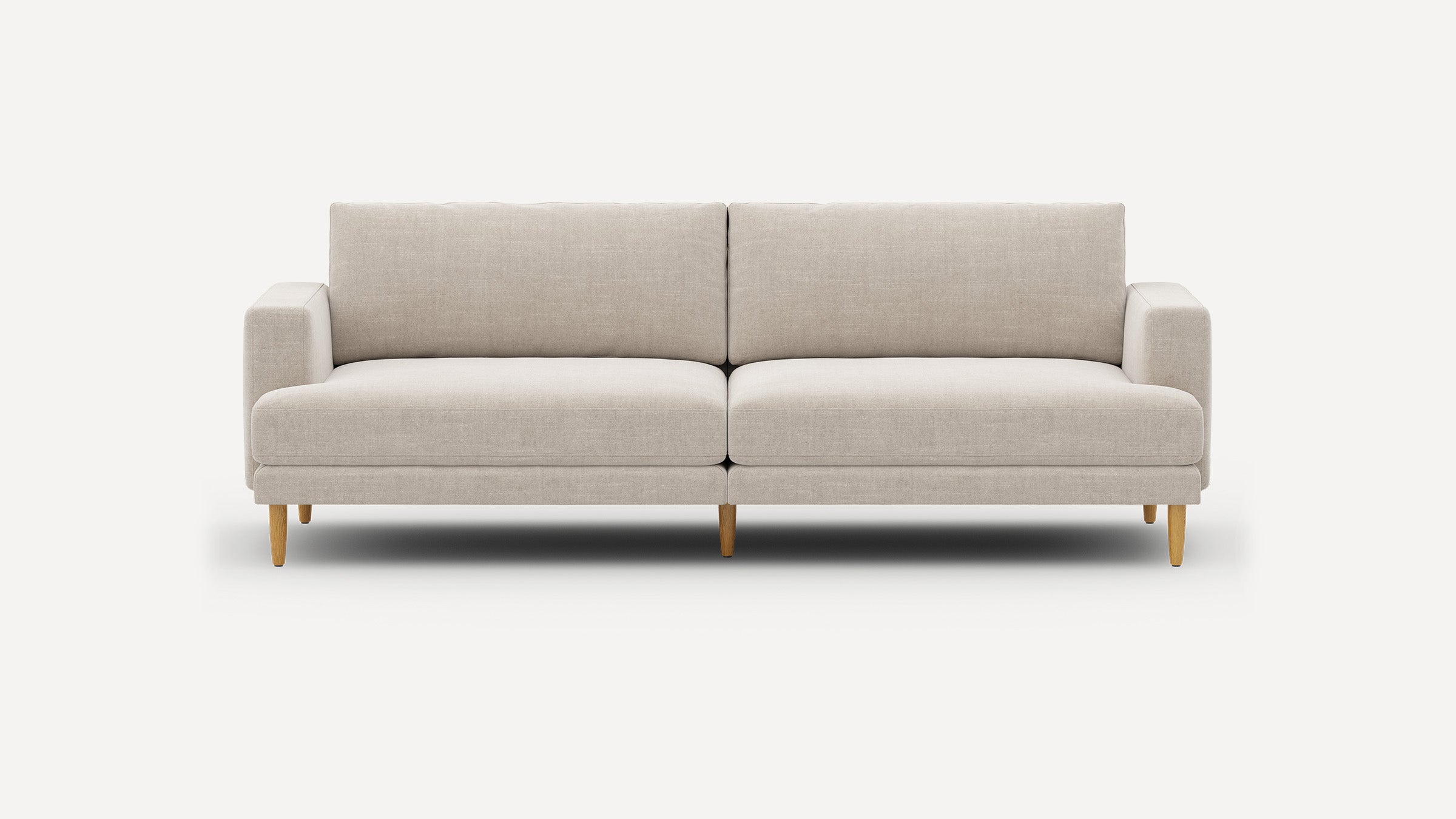 Modern beige fabric sofa with clean lines, wooden tapered legs, squared armrests, and a cushioned backrest, ideal for contemporary living spaces.
