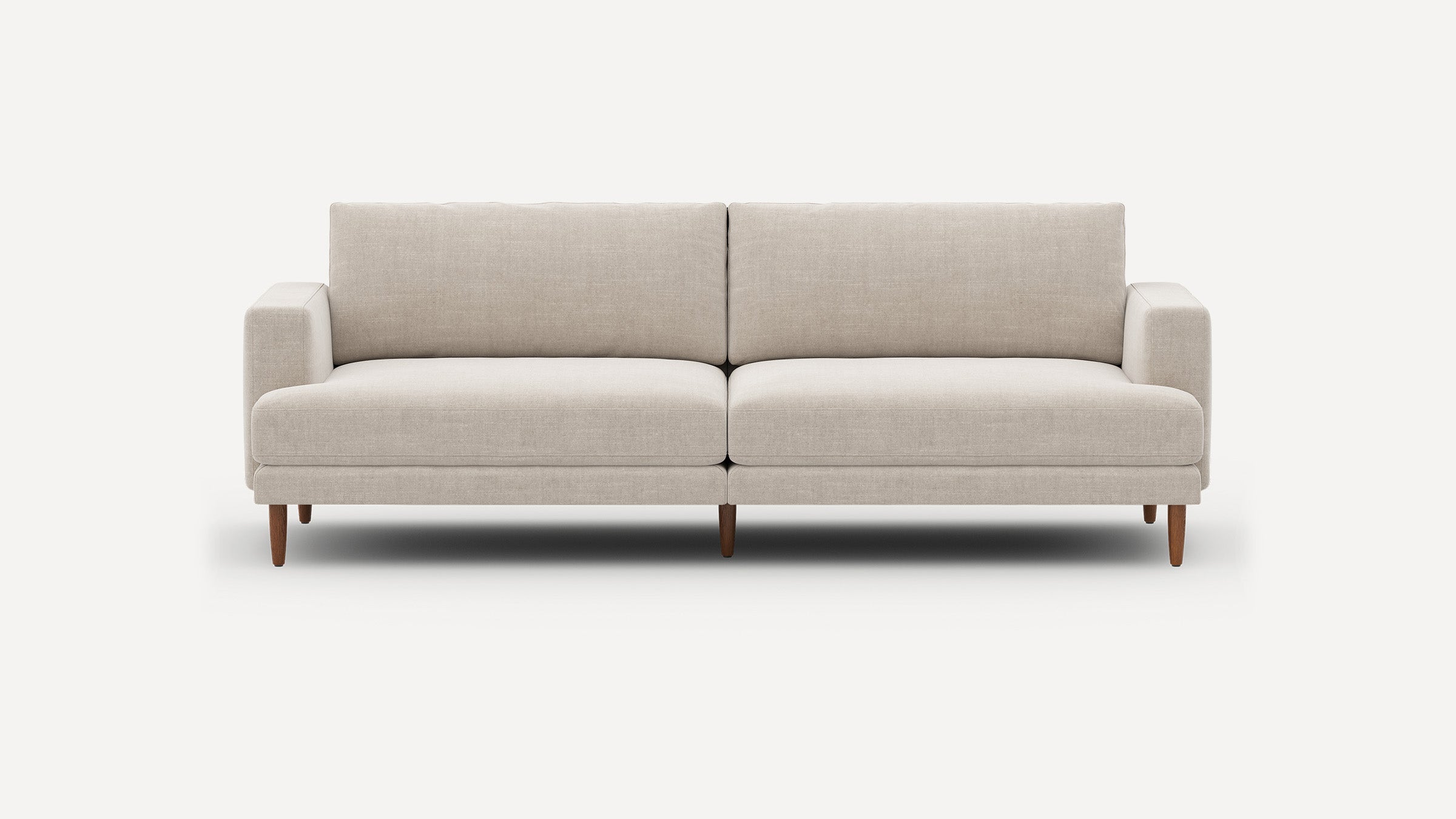 Modern mid-century style sofa with light beige upholstery, wooden tapered legs, straight arms, and clean lines, shown against white background.