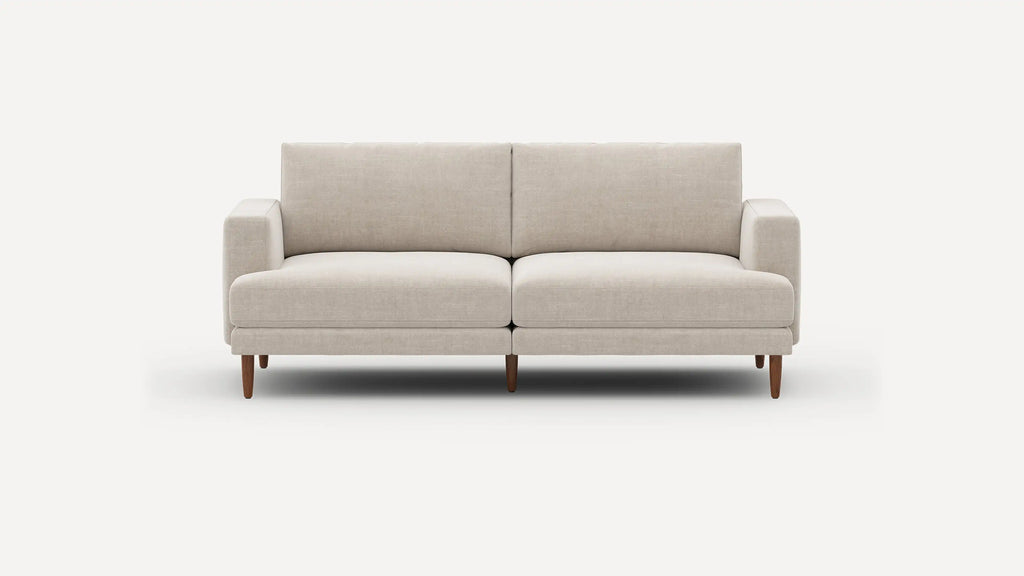 Beige modern two-seater sofa with clean lines, fabric upholstery, and wooden tapered legs against a plain white background.