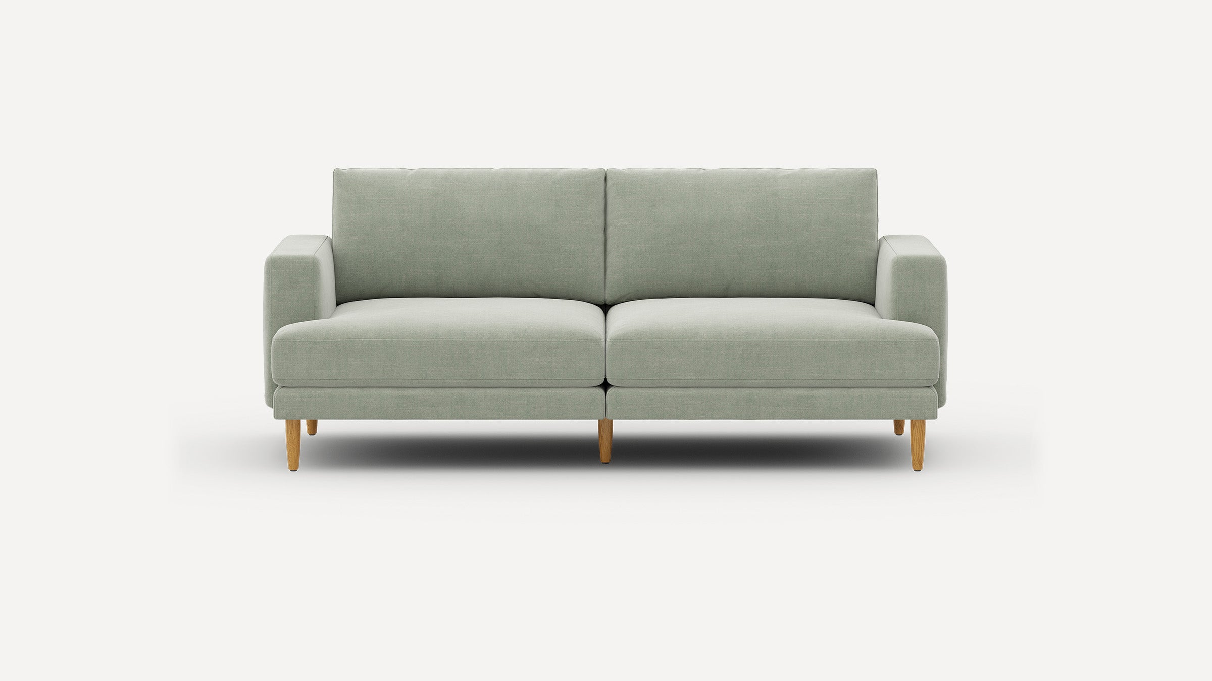 Modern light gray fabric sofa with clean lines, square arms, cushioned seats, and wooden tapered legs on a white background.
