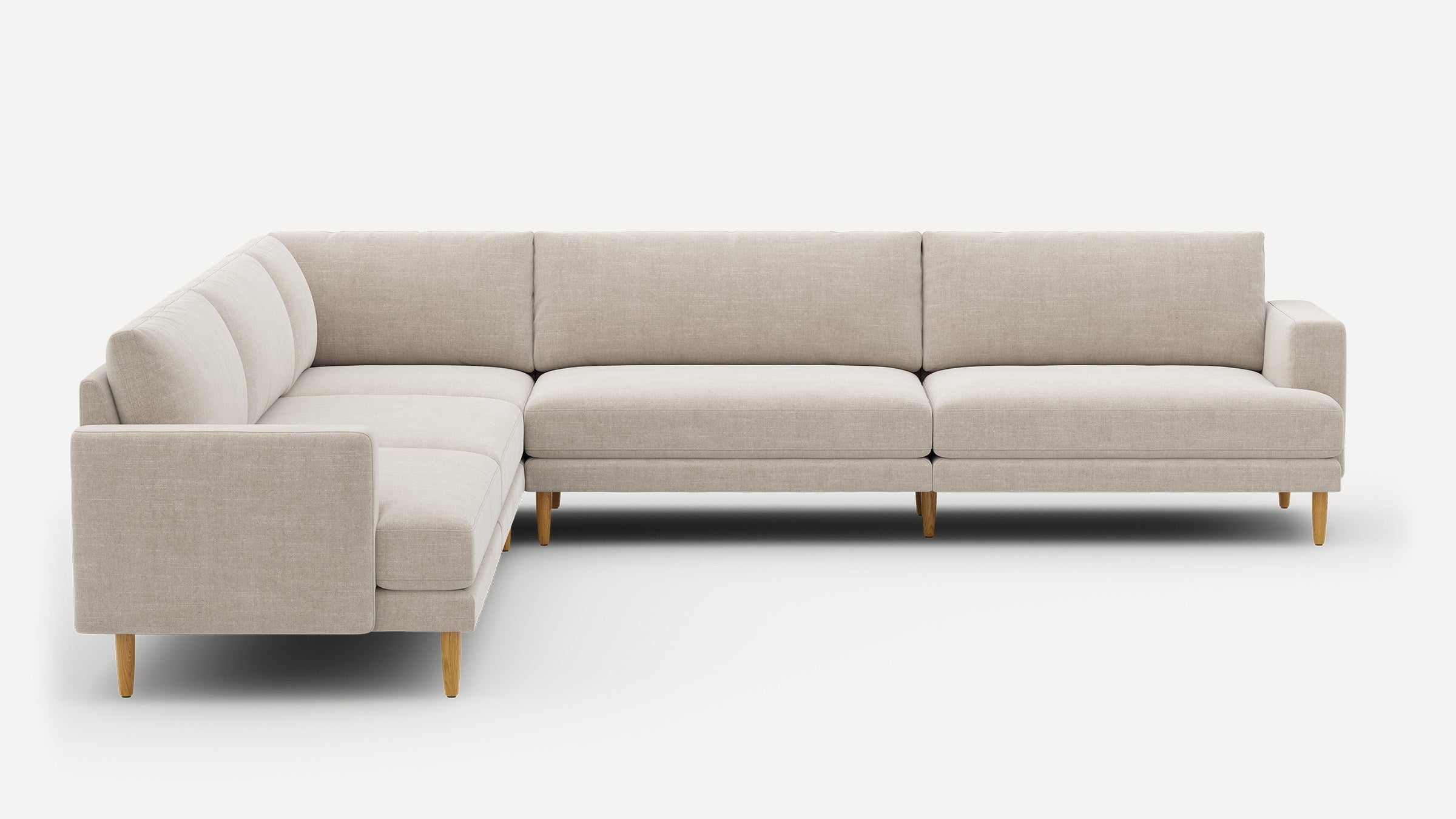 Modern light beige L-shaped sectional sofa with clean lines and wooden legs on a white background.